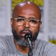 Salim Akil speaks onstage at the ‘Black Lightning’ Special Video Presentation and Q&A during Comic-Con International 2018 on July 21, 2018 in San Diego, California.